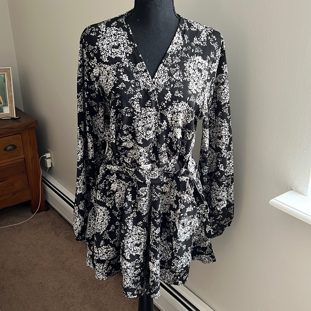 Floral romper, black and white wrap style with tie belt at waist, size L